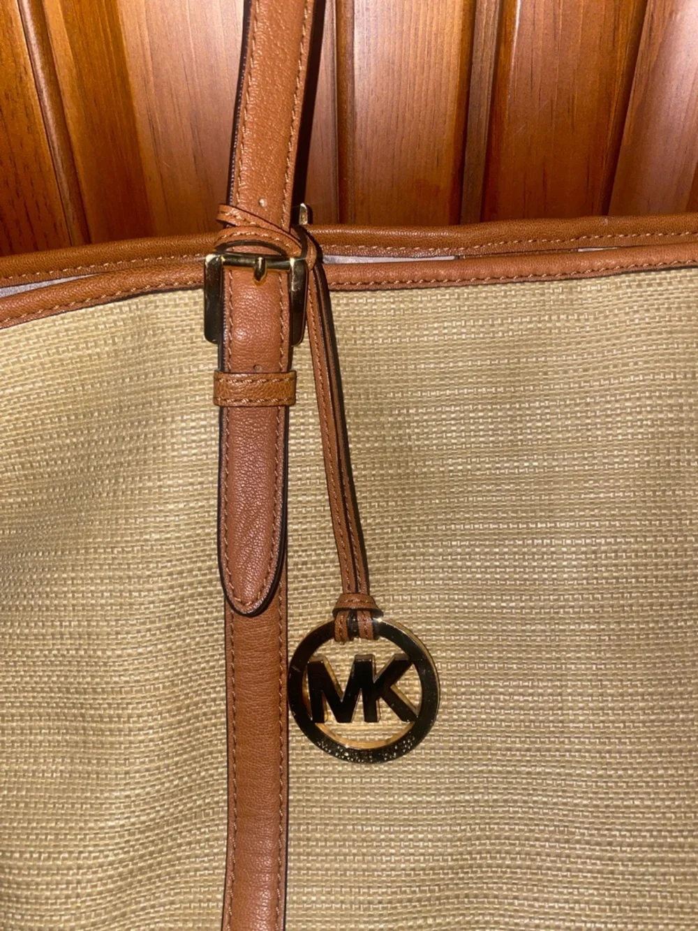 Michael Kors Raffia Tote with Tan Leather Trim and handles.